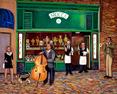 The Cafe Mocca is located in San Francisco  and has out door dinning wit waitors and live music  and a base player.
