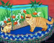These red tabby Persians are fasinated by a golddfish tank on a table.