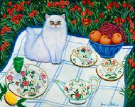 White persian cat sitting on a quilt with fruit and china surrounded with red poppies.